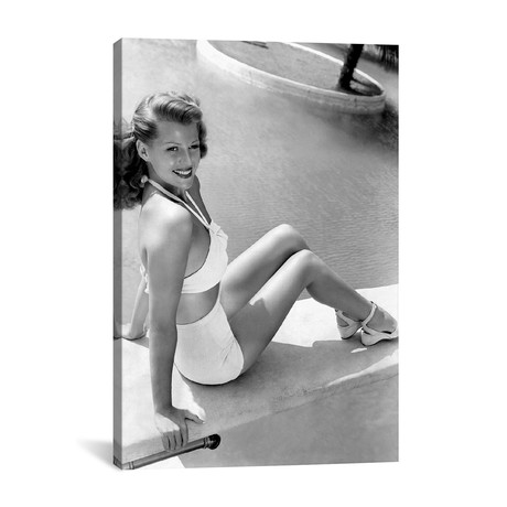 Rita Hayworth Sitting Next To A Pool