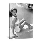 Rita Hayworth Sitting Next To A Pool