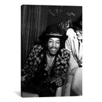 Jimi Hendrix Sitting Backstage // Globe Photos, Inc. (18"W x 26"H x 0.75"D)