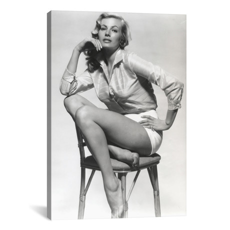 Anita Ekberg Seated In Chair Wearing A Glossy Long Sleeves // Movie Star News