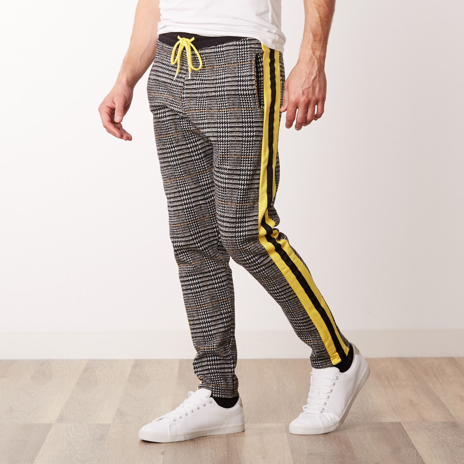 yellow pants with black side stripe