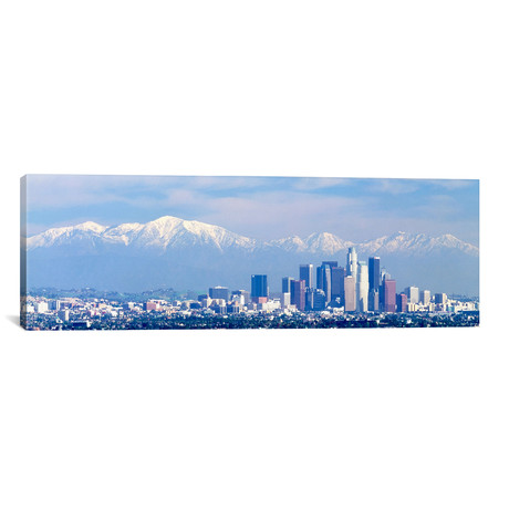 Buildings in a city with snowcapped mountains in the background // Panoramic Images (12"W x 36"H x 0.75"D)