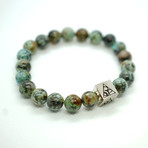 African Turquoise Bead Bracelet // Silver Logo Bead