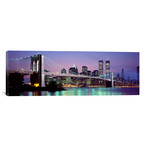 An Illuminated Brooklyn Bridge With Lower Manhattan's Financial District Skyline In The Background, New York City, New York  // Panoramic Images (36"W x 12"H x 0.75"D)