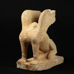 Monumental Archaic Greek Limestone Statue of a Sphinx