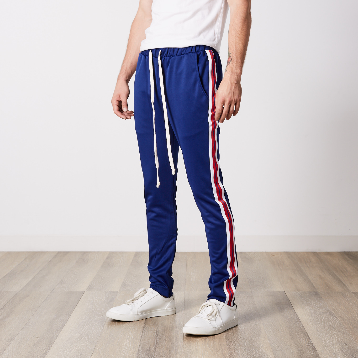 taped track pants