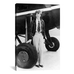 Amelia Earhart Standing By An Airplane // Globe Photos, Inc. (18"W x 26"H x 0.75"D)