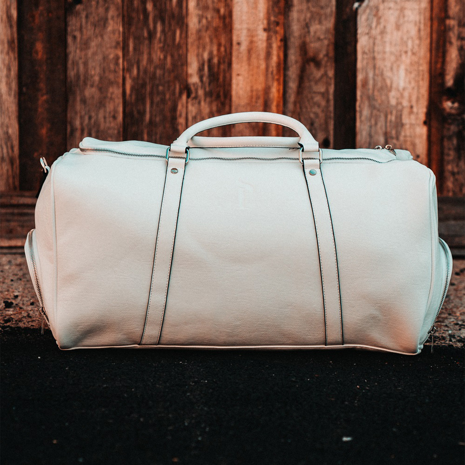 white duffel travel bag