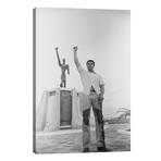 Muhammad Ali Posing In Front Of The Le Militant Statue, Kinshasa, Zaire // Muhammad Ali Enterprises