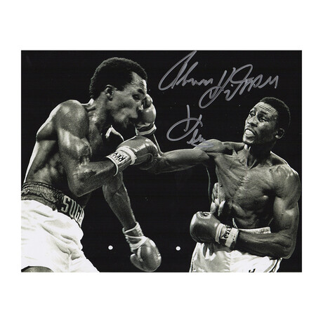 Thomas Hearns // B&W "Boxing, Punching Sugar Ray Leonard" // Signed 8x10 Photo // "Hitman" Inscription