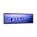 Surfers on Beach Costa Rica by Panoramic Images (12"H x 36"W x 0.75"D)