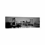 Illuminated Brooklyn Bridge With Lower Manhattan's Financial District Skyline In The Background In B&W, New York City, New York  // Panoramic Images (16"H x 48"W x 0.75"D)