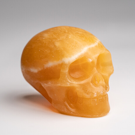 Genuine Polished Orange Calcite Skull Carving // 127.4 g