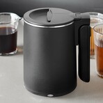 Elite Gourmet EKT719 Dual Voltage 110-220V US Plug, Travel Double Wall Insulated Cool-Touch, 0.6L Electric Kettle, Stainless Steel Interior, Hinged-Locking Lid, Retractable Handle, Auto Shut-Off, Boil Dry Protection, matte Black